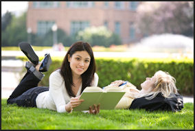 career advice students women laying grass smiling reading